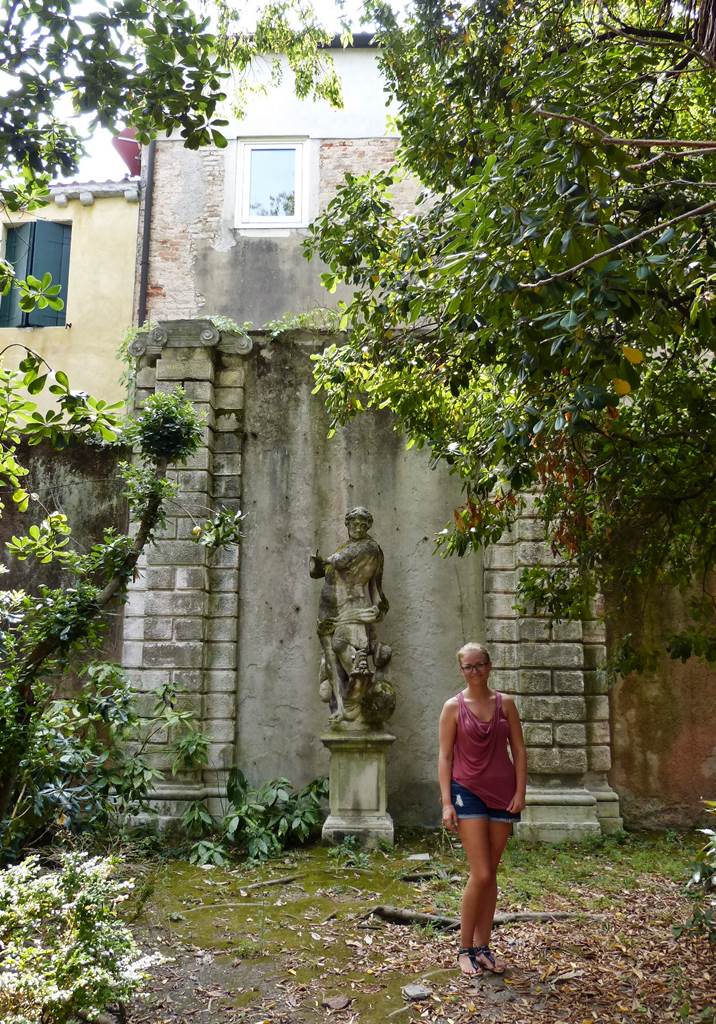 Girl standing in the garden of Ca'Tron in Venice