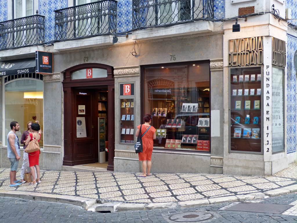 moments of travel in front of Livraria Bertrand, the oldest library in the world in Lisbon, Portugal