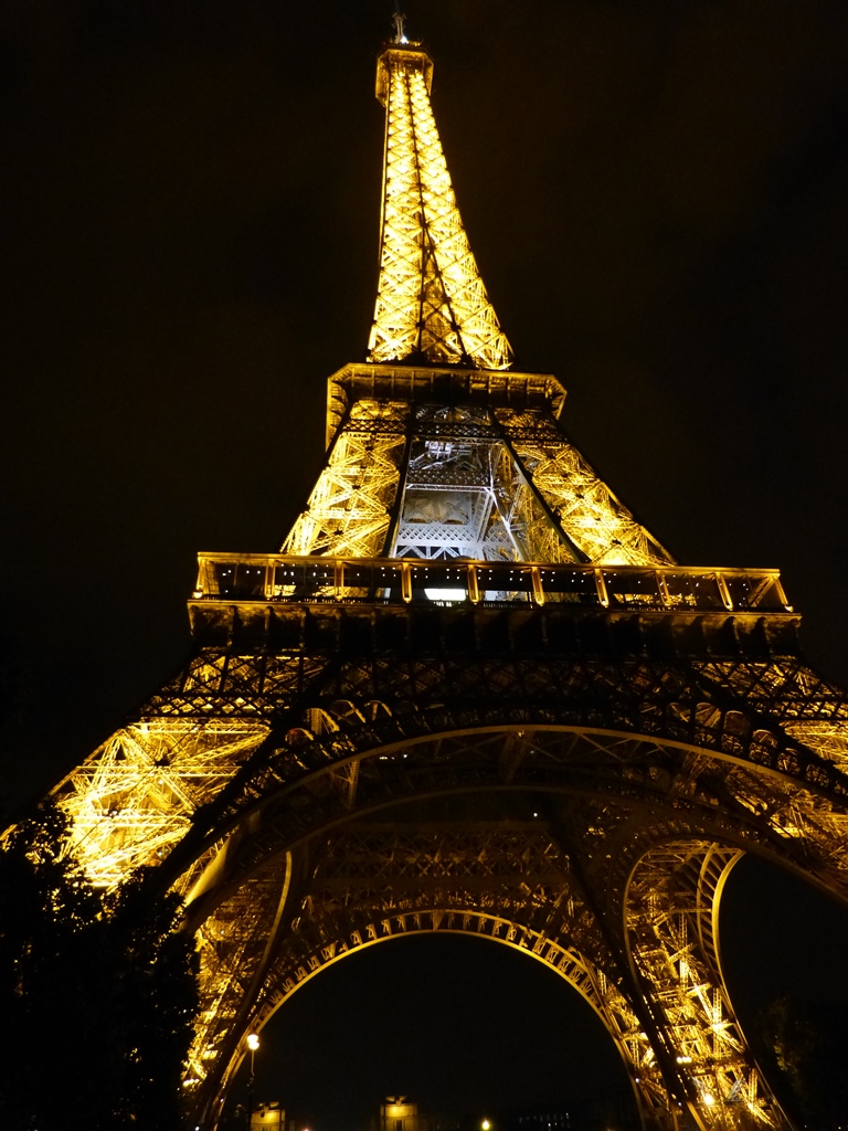 moments of travel at the Eiffel Tower at night in Paris