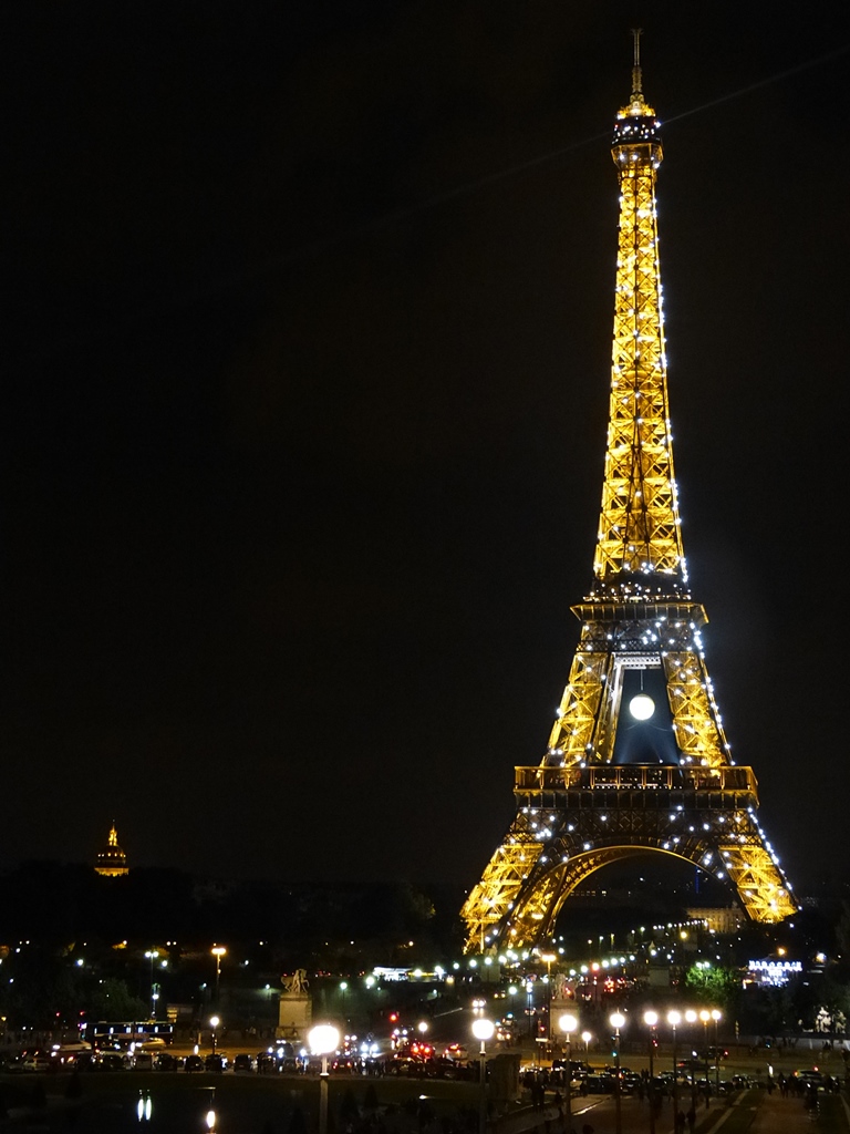 moments of travel at the Eiffel Tower at night in Paris