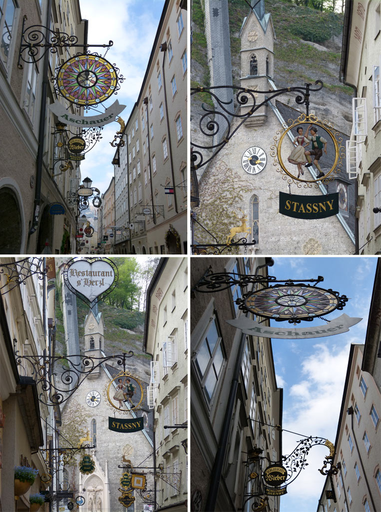 Ladenschilder und Kiche in der Getreidegasse in Salzburg